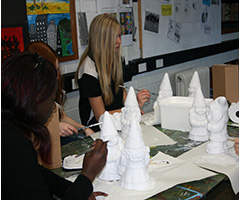 Students preparing their gnomes for Floriade